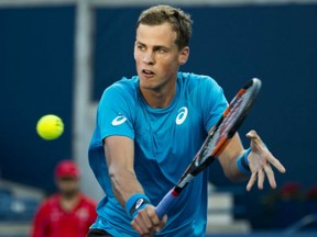 Vasek Pospisil of Canada returns the ball against Jeremy Chardy of France during Pospisil's first round Rogers Cup win in Toronto on Tuesday.