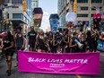 People from the group Black Lives Matter lead the annual Pride Parade in Toronto on Sunday July 3, 2016.