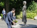 Prime Minister Justin Trudeau and his son, Xavie pay their respects to the victims of the 1932-1933 great famine at the Holodomor famine memorial in Kyiv, Ukraine, on July 11, 2016.