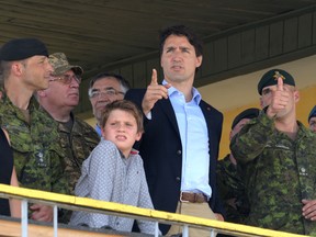 Prime Minister Justin Trudeau and his son Xavier watch Ukrainian military exercises with Canadian military instructors at the International Peacekeeping and Security Center in Yavoriv, near Lviv during the PM's trip to Europe in July.