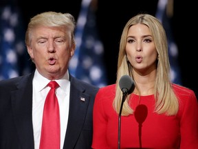 Republican presidential candidate Donald Trump, left, and his daughter Ivanka Trump test the teleprompters and microphones on stage before the start of the fourth day of the Republican National Convention on Thursday in Cleveland, Ohio.