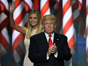 Donald Trump takes the stage as his daughter Ivanka Trump leaves the stage on the last day of the Republican National Convention on July 21, 2016, in Cleveland.