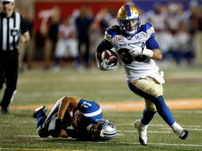 Alouettes linebacker Chip Cox falls to the turf after failing to stop Winnipeg Blue Bombers running back Andrew Harris during CFL action at Molson Stadium on Friday. Harris scored a touchdown on the play.