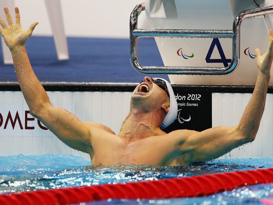 Paralympic swim star Benoit Huot helps Toronto Blue Jays' Russell