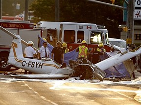 Emergency crews work at the scene of a plane crash near High and Lansdowne streets on Friday, Aug. 12, 2016 in Peterborough. The crash happened at about 1:20 a.m.