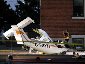 Emergency crews work at the scene of a plane crash near High and Lansdowne streets on Friday, Aug. 12, 2016 in Peterborough.