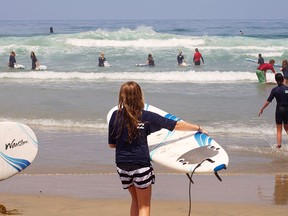 Surfing at La Jolla beach is just one of many activities kids and adults can enjoy on a visit to San Diego, which offers a ' Kids Free' promotion in October.