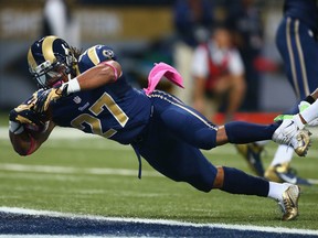 Los Angeles Rams running back Tre Mason rushes for a touchdown during an October 2014 game in St. Louis.