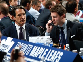 Kyle Dubas (R) will continue as GM of the AHL's Toronto Marlies, overseeing all prospects within the club's system while also leading the Maple Leafs' player development, hockey research and development departments.