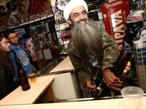 Osama bin Laden lookalike Ceara Francisco Helder Braga Fernandes (R) serves customers in his 'Bar do Bin Laden' in Sao Paulo, Brazil. Though reviled in much of the West, the Bin Laden name generally does not carry the same stigma in Brazil, a country that has been spared the large-scale terrorist attacks that have horrified many other parts of the world. A sense of rebellion and defiance might also play into the proliferation of the Bin Laden phenomenon.