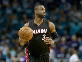 In this April 25 file photo, Dwyane Wade handles the ball in a game against the Charlotte Hornets.