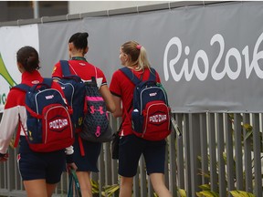 Russian athletes walk at the Olympic Village ahead of the Rio 2016 Games in August.