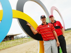 Canadian golfers Graham Delaet (left) and David Hearn pose near the Olympic clubhouse during a practice round in Rio on Monday.
