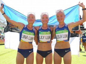 (L-R) Liina Luik, Lily Luik, and Leila Luik of Estonia pose after the Women's Marathon on Day 9 of the Rio 2016 Olympic Games at the Sambodromo on August 14, 2016 in Rio de Janeiro, Brazil.
