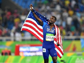 Justin Gatlin of the United States waves to the crowd after finishing second in the men's 100-metre relay in Rio on Sunday.