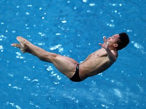 Reigning world champion Chao He of China blamed the wind after he scored just 27.75 points on his third dive and failed to advance to the next round.