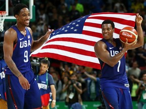 DeMar DeRozan (left) and Kyle Lowry celebrate after the U.S. beat Serbia 96-66 to win men's basketball gold at Rio 2016 on Aug. 21.
