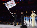 Rio de Janeiro Mayor Eduardo Paes waves the Olympic flag during the Rio 2016 closing ceremony on Aug. 21.