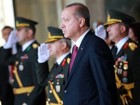 Turkish President Recep Tayyip Erdogan looks on during a ceremony at the Ataturk Mausoleum to mark 94th anniversary of Turkeys Victory Day in Ankara on August 30, 2016.