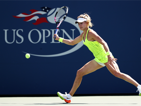 Eugenie Bouchard returns a ball during her first-round U.S. Open loss to Katerina Siniakova on Aug. 30.