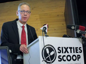 Lawyer Jeffery Wilson is seen at a news conference in Toronto on Thursday, Dec. 4, 2014. Wilson is a lawyer in a novel class-action lawsuit that blames the Canadian government for the loss of cultural identity of thousands of aboriginal children in Ontario.