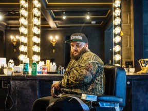 Co-owner of Notorious Barbershop Corey Shapiro poses for a photograph at his shop the neighbourhood of St-Henri in 2015