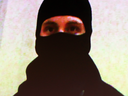An image from a video showing Aaron Driver making terror threats.