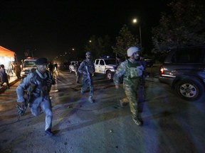Afghan security forces rush to respond to a complex Taliban attack on the campus of the American University in the Afghan capital Kabul on Wednesday, Aug. 24, 2016.