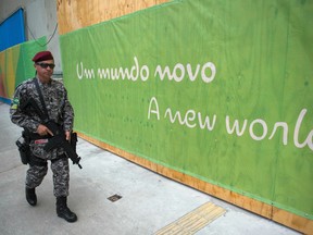 A Brazilian police officer patrols outside the Sambodromo stadium in Rio on Wednesday.