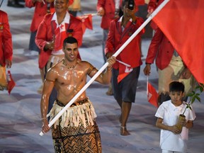 Tongan flagbearer Pita Nikolas Taufatofua leads his delegation during the opening ceremony in Rio on Friday.