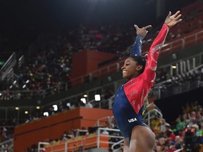 U.S. gymnast Simone Biles competes in the qualifying for the women's Beam event of the Artistic Gymnastics at the Olympic Arena during the Rio 2016 Olympic Games in Rio de Janeiro on August 7, 2016.