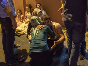 Relatives grieve at hospital August 20, 2016 in Gaziantep following a late night militant attack on a wedding party in southeastern Turkey.