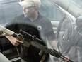 Todd Savage, a retired Marine who moved to north Idaho from San Francisco and opened American Redoubt Realty, displays a firearm that he routinely carries with him in Sandpoint, Idaho