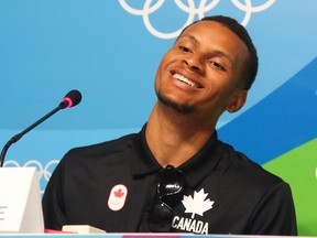 Andre de Grasse of Canada smiles during a press conference at the 2016 Summer Olympics in Rio de Janeiro, on Saturday, Aug. 20, 2016.