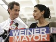 In this July 23, 2013 file photo, Huma Abedin, alongside her husband, then-New York mayoral candidate Anthony Weiner, speaks during a news conference in New York. Abedin says she is separating from husband Weiner after another sexting revelation involving the former congressman from New York.