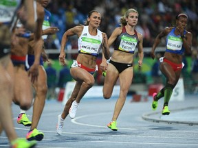 Canada's Brianne Theisen Eaton, right, was chasing Britain's Jessica Ennis-Hill through Day 1 of  the women's heptathlon on Friday.