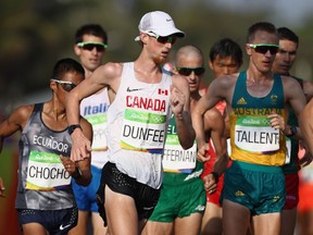 In this Aug. 19, 2016 file photo, Evan Dunfee competes in the men's 50-km race walk at the Rio Olympics.
