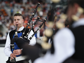 A musician of the traditional bagad band of Carhaix, plays bagpipes before taking part in a competition during the 46th Lorient Interceltic Festival (FIL) on August 6, 2016 in Lorient, western France.