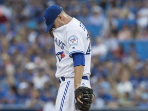 Toronto Blue Jays starting pitcher Marco Estrada reacts after giving up a solo home run to Los Angeles Angels' Mike Trout during the first inning of the Angels' 8-2 win in Toronto, Wednesday.