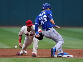 Cleveland's Jason Kipnis attempts to tag Toronto's Devon Travis at second base on Aug. 20.