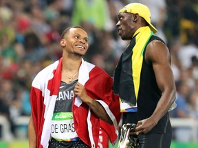 Usain Bolt stood side-by-side with Andre De Grasse, the present and the future, looking like he might have been Bolt’s little brother.