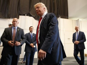 Republican presidential candidate Donald Trump walks away after speaking to reporters before a town hall event, Monday, Aug. 1, 2016, in Columbus, Ohio . (AP Photo/Evan Vucci)