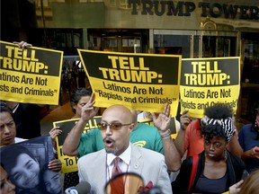 Kirsten John Foy, president of Brooklyn chapter of the National Action Network, leads a rally of anti-Trump protesters outside a meeting between Donald Trump and minority Republicans at Trump Tower. "We are not going to let Donald Trump take America backwards," said Foy. "We are not going to let him resurrect Jim Crow."