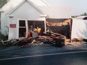 Damage to Maureen Noble's house in Tracy, N.B. is shown in a 2007 handout photo. Noble can't quite recall exactly how many cars have hit her house, she didn't start counting until about 25 years ago.