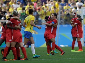 Canada celebrates winning the bronze medal in women's soccer at Rio 2016.