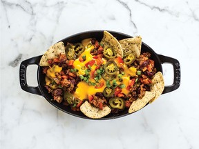 "You won't believe how decadent tasting—yet wholesome—the cheese sauce is, and how satisfying the smoky lentil and kidney bean chili is," Liddon writes of her Chili Cheese Nachos.