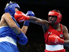 Claressa Shields of the United States fights Dariga Shakimova of Kazakhstan during the Olympic Games at the Riocentro arena in Rio de Janeiro, Brazil.
