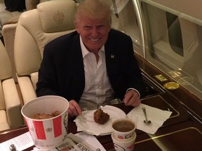 Trump eating KFC with a knife and fork.