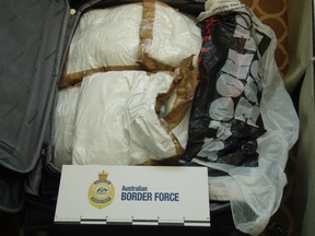 In this photo released by Australia Boarder Force, a suitcase filled with cocaine after it was seized by customs onboard the MS Sea Princess in Sydney, Australia, Sunday, Aug. 28, 2016. Three Canadian cruise ship passengers were charged with drug smuggling on Monday.