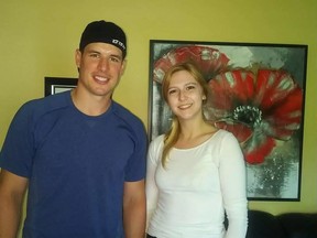 Sidney Crosby poses with Madisyn Pottie after dropping in unexpectedly to the Pottie home in Enfield, N.S., to sign her father’s jersey.